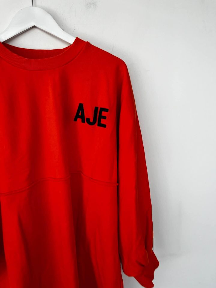 Aje orange jumper - size medium